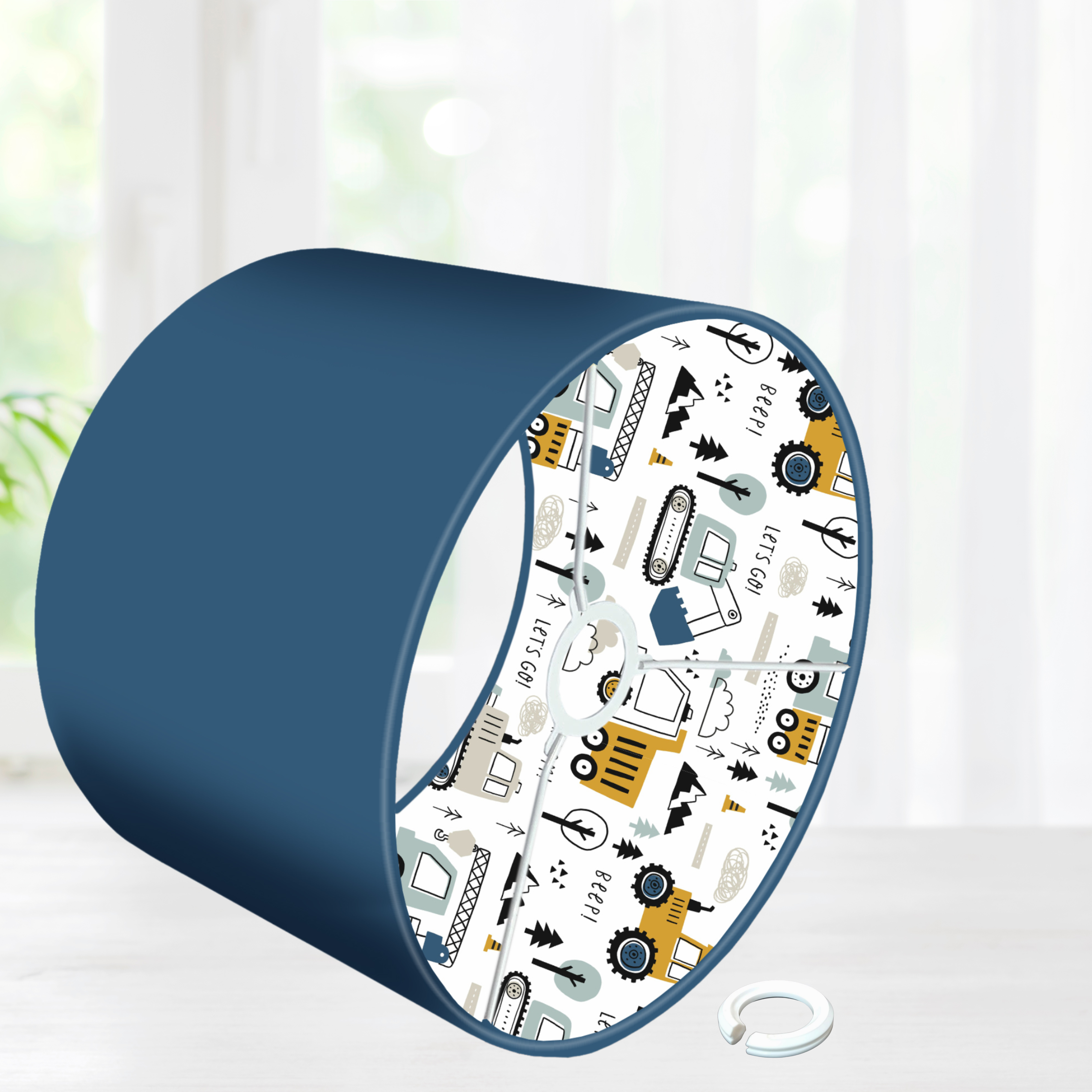 This fun lined ceiling lampshade features our best selling 'Let's Go' pattern featuring construction vehicles including cranes, tractors and diggers on the inside, and your choice of a solid blue, mustard or grey on the outside.