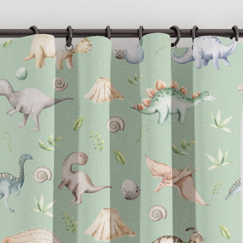 Blackout lined children's bedroom and nursery curtains featuring watercolour dinosaurs on a green background. Made to measure curtains, custom made to your exact requirements by our professionally trained curtain maker.