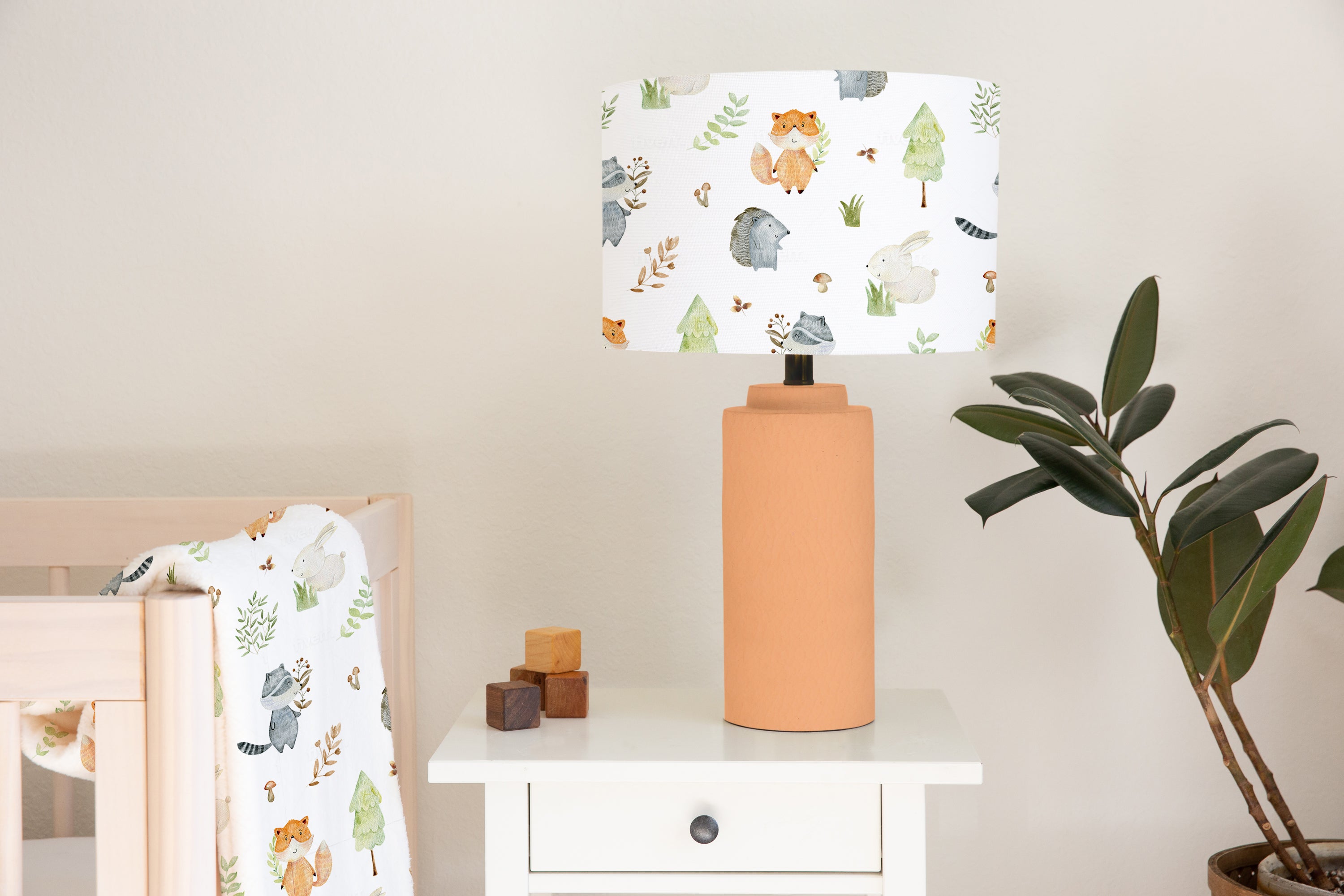 Children's bedroom and nursery ceiling and lampshade, woodland animals, squirrels, rabbits, hedgehogs, plant leaves, trees, and mushrooms.