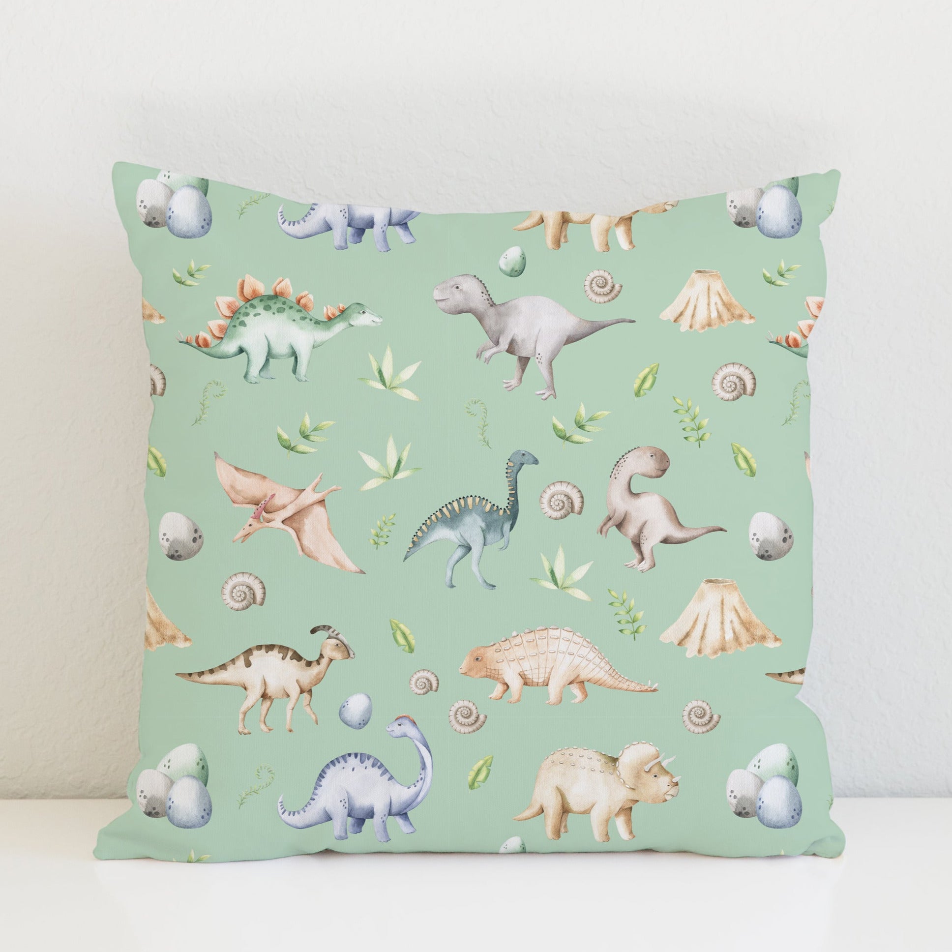 Children's bedroom and nursery watercolour dinosaurs square cotton cushion cover, green. Nursery bedding and soft furnishings. Free shipping.