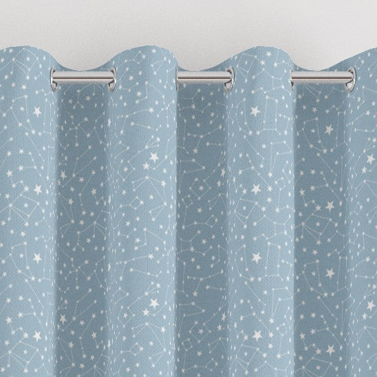 Eyelet constellation print children's bedroom and nursery curtains, white and blue.