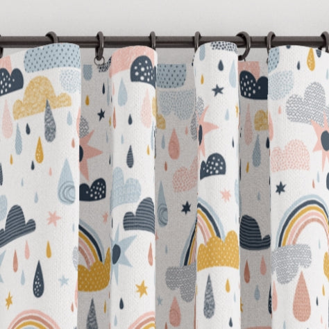 Pencil pleat children's bedroom and nursery curtains in rainbows, clouds and raindrops print. Big Little Bedrooms. Free Shipping.