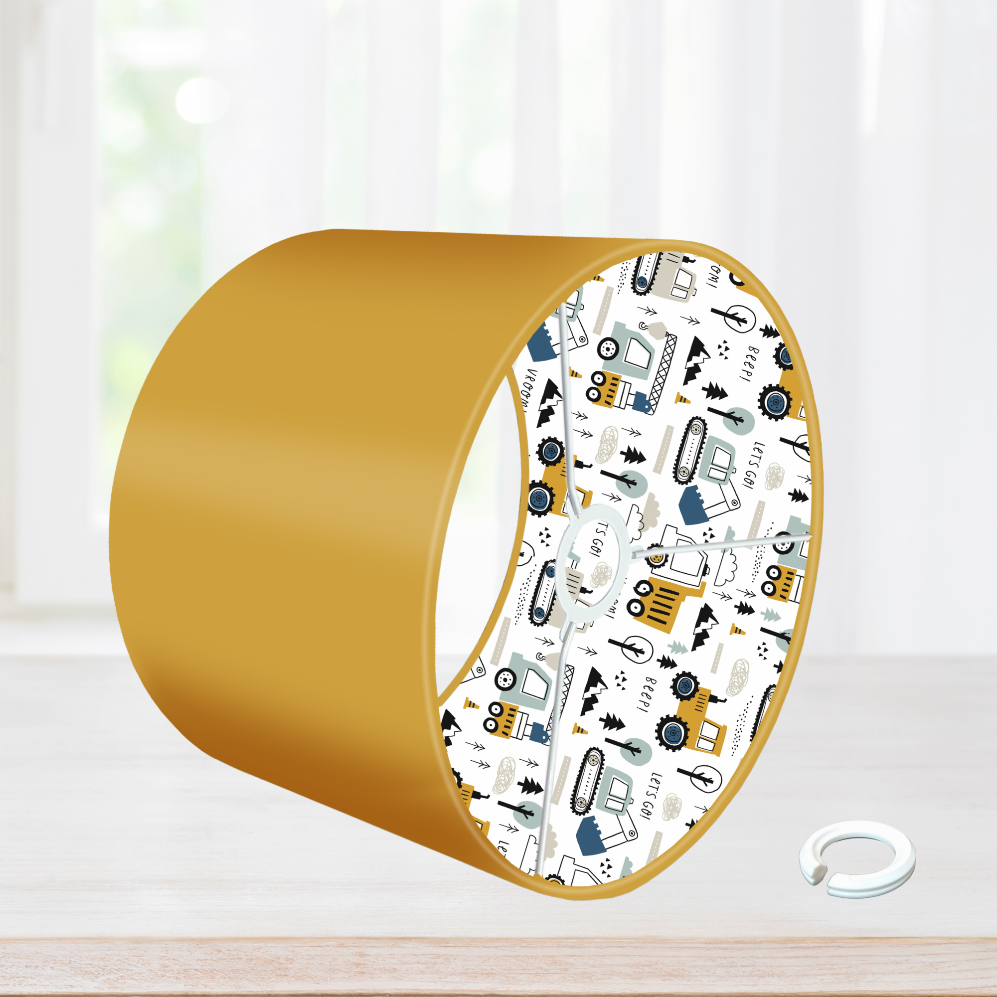 This fun lined ceiling lampshade features our best selling 'Let's Go' pattern featuring construction vehicles including cranes, tractors and diggers on the inside, and your choice of a solid blue, mustard or grey on the outside.