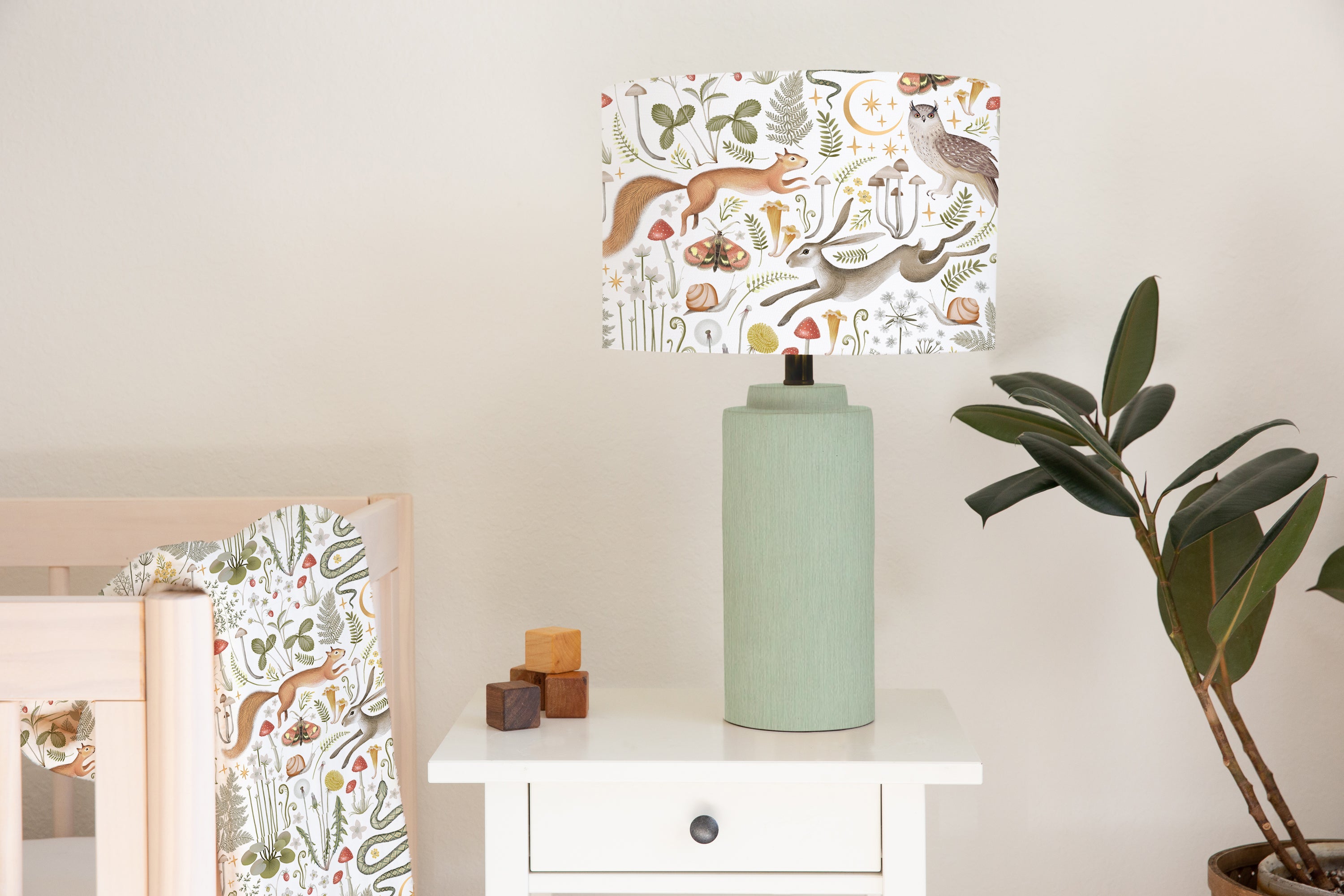 Children's bedroom and nursery ceiling and lampshade, woodland animals, snakes, rabbits, squirrels, owls, butterflies, and snails, leaves, flowers, and mushrooms.