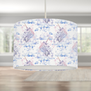 This beautiful children's bedroom or nursery drum lampshade features unicorns in soft watercolour shades of blues, lilacs and pinks.