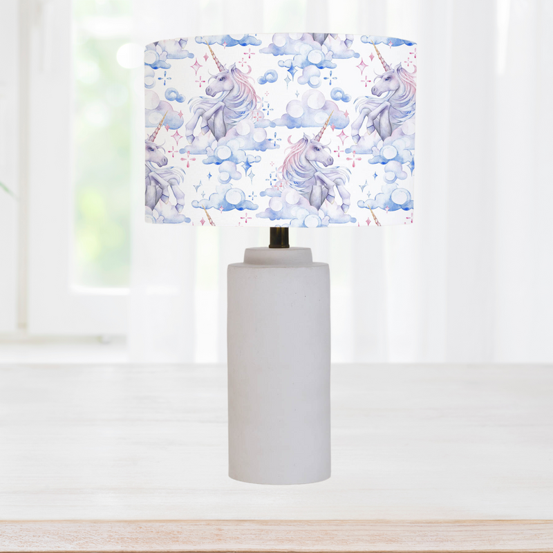 This beautiful children's bedroom or nursery drum lampshade features unicorns in soft watercolour shades of blues, lilacs and pinks.