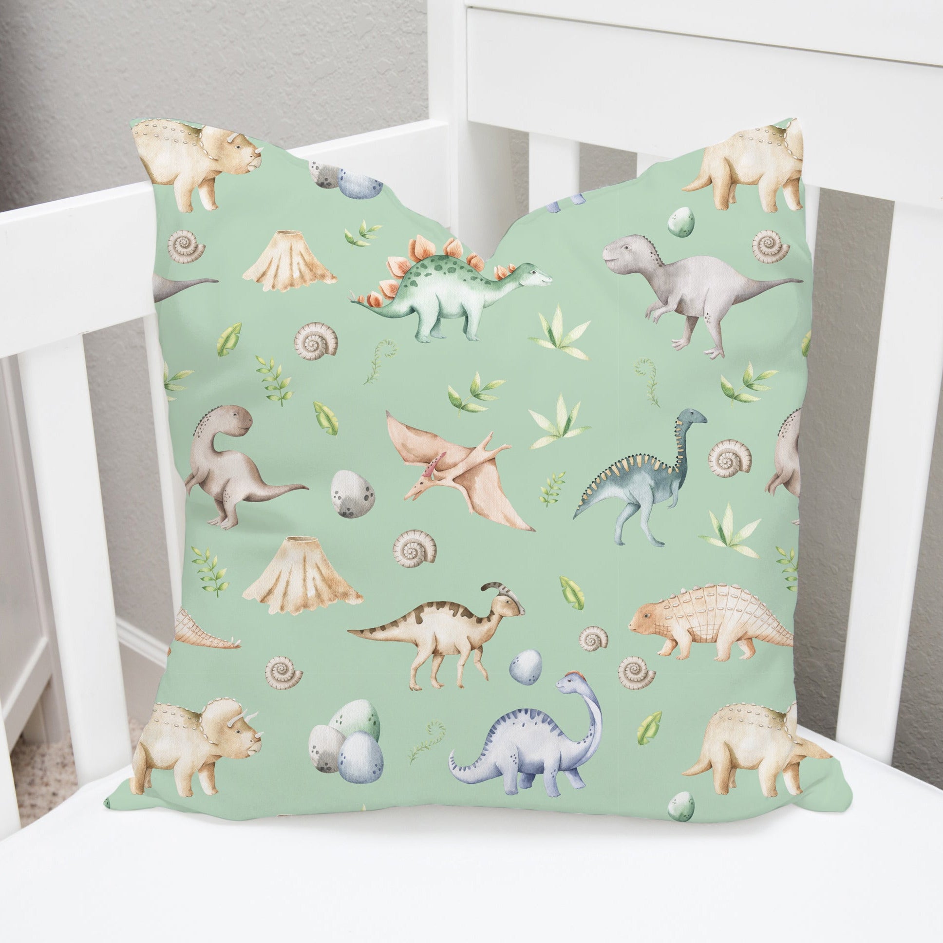 Children's bedroom and nursery watercolour dinosaurs square cotton cushion cover, green. Nursery bedding and soft furnishings. Free shipping. 