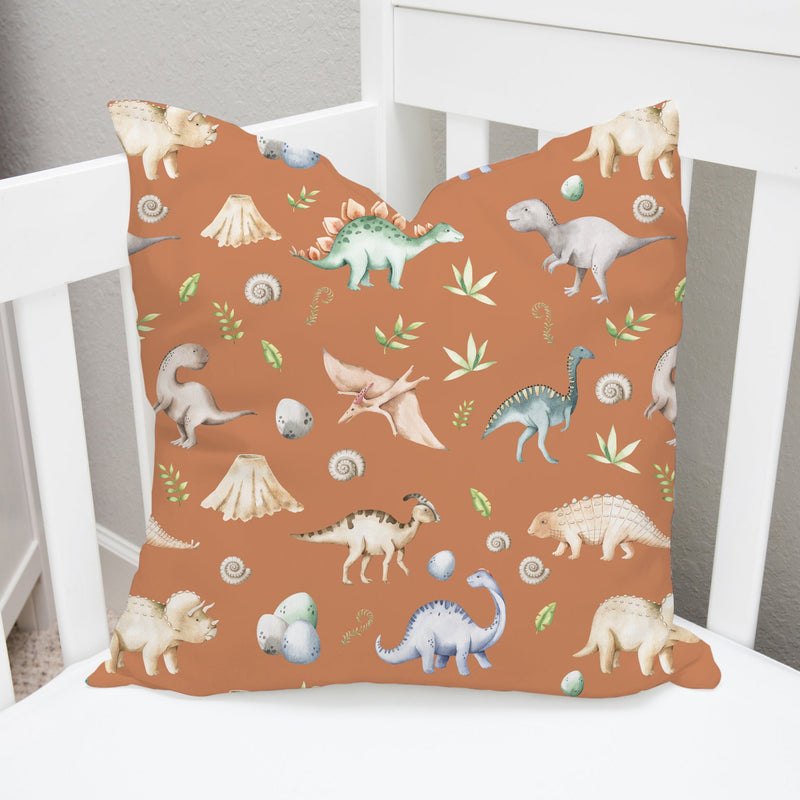 Children's bedroom and nursery watercolour dinosaurs square cotton cushion cover, terracotta. Nursery bedding and soft furnishings. Free shipping. 