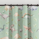 Blackout lined children's bedroom and nursery curtains featuring watercolour dinosaurs on a green background.  Made to measure curtains, custom made to your exact requirements by our professionally trained curtain maker.