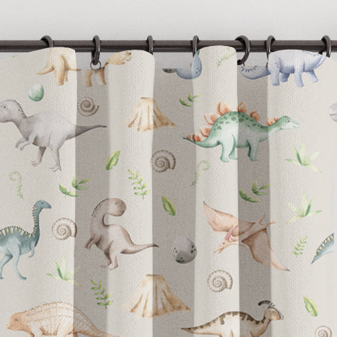 Children's bedroom and nursery blackout lined watercolour dinosaur curtains, natural. Gender neutral eyelet and pencil pleat made to measure children's curtains.