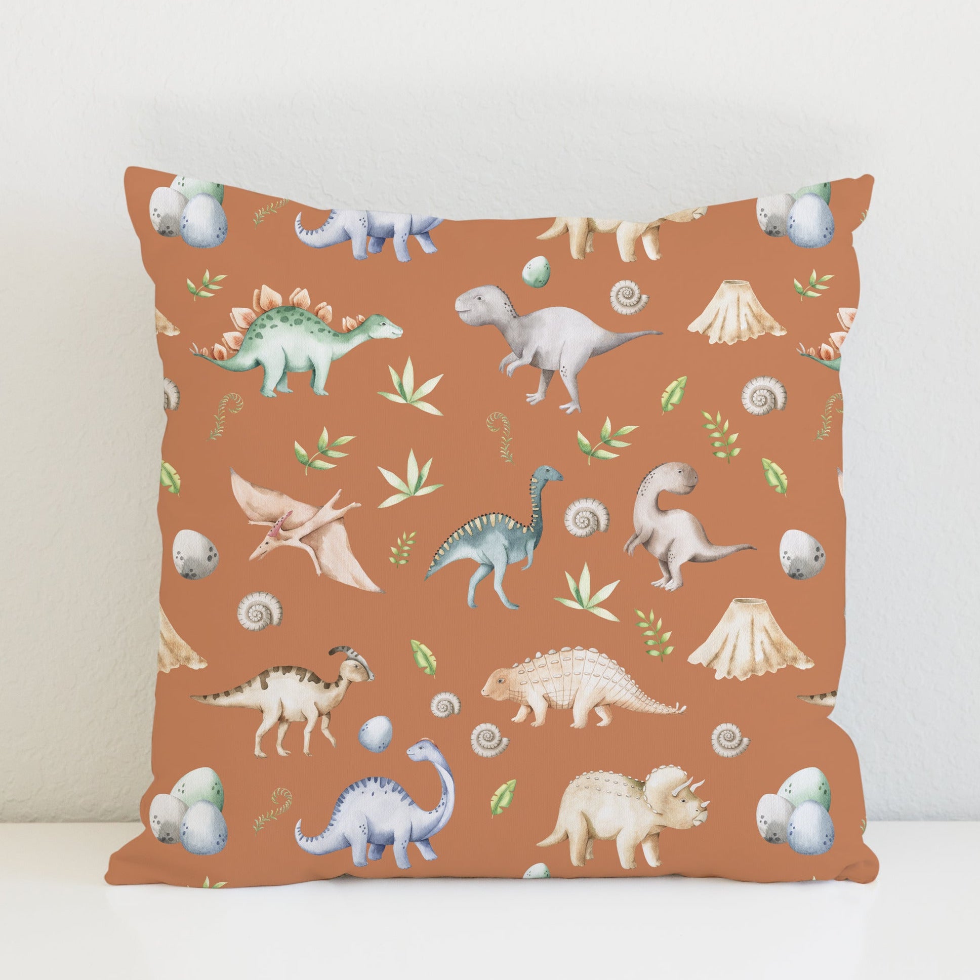 Children's bedroom and nursery watercolour dinosaurs square cotton cushion cover, terracotta. Nursery bedding and soft furnishings. Free shipping. 