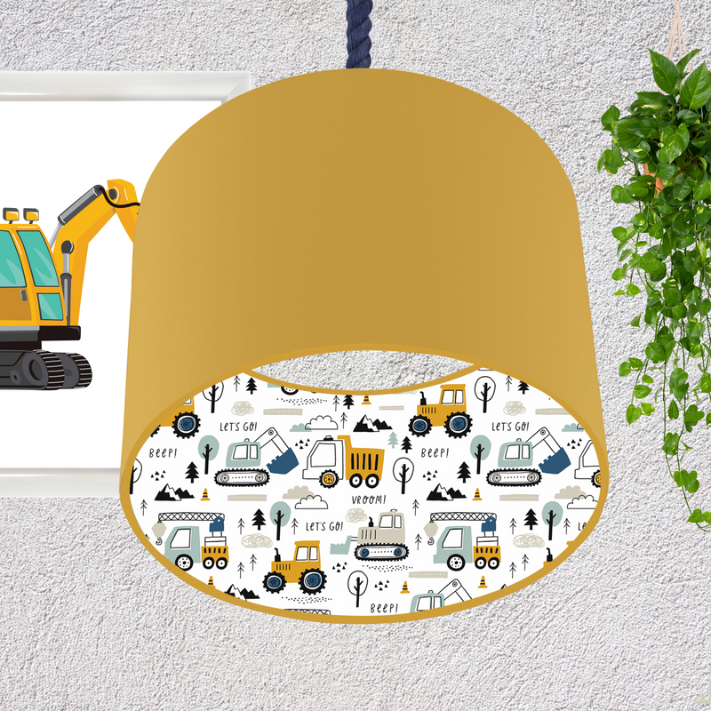 This fun lined ceiling lampshade features our best selling 'Let's Go' pattern featuring construction vehicles including cranes, tractors and diggers on the inside, and your choice of a solid blue, mustard or grey on the outside.  