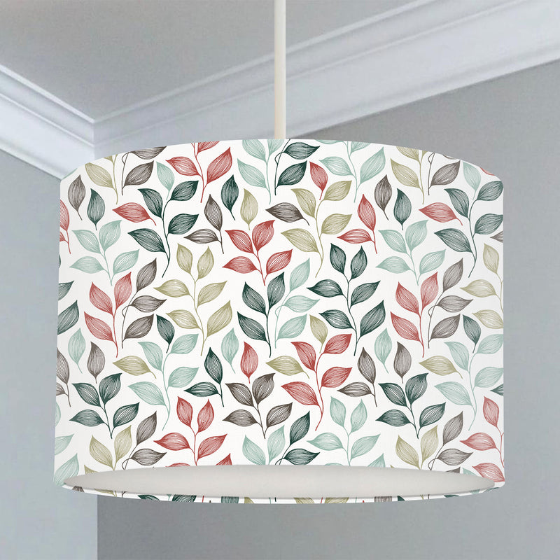 Children's bedroom and nursery lampshade, blue, green, red and grey colored autumn leaves.
