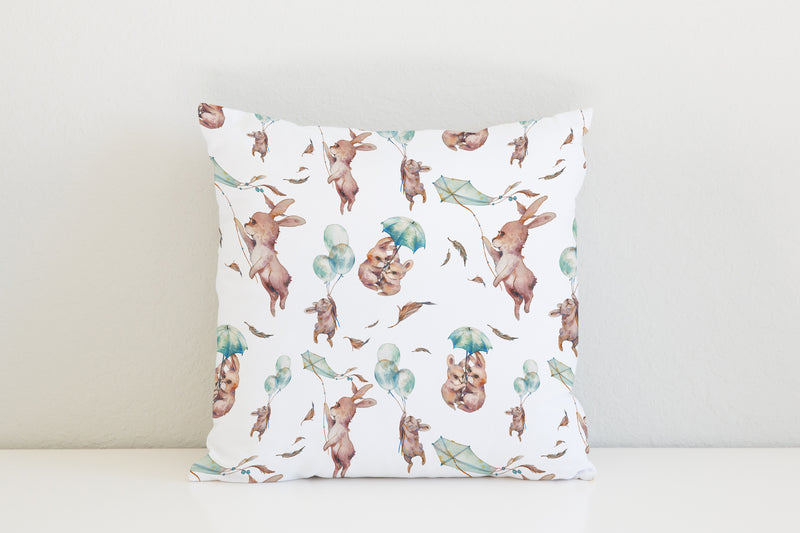 Gender neutral children's bedroom and nursery pillows and bedding, bunny rabbits on a windy day
