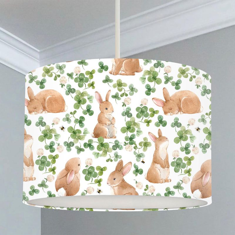 Children's bedroom and nursery lampshade, brown bunnies, and green leaves.
