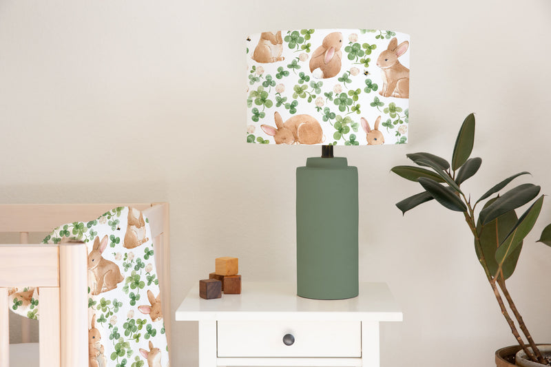 Children's bedroom and nursery ceiling and lampshade, brown bunnies, and green leaves.