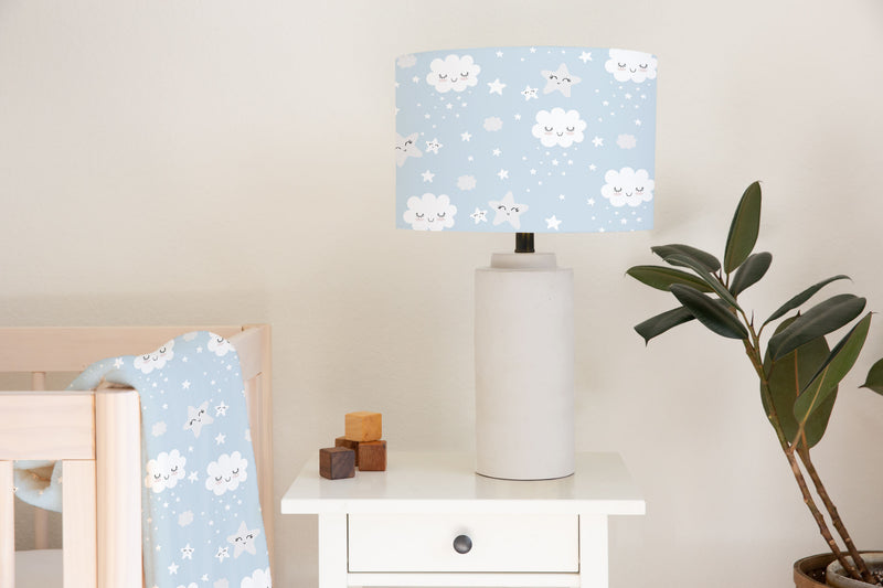 Children's bedroom and nursery ceiling and lampshade, blue and white, smiling clouds, and smiling stars. 