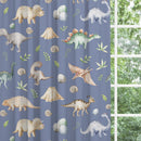 Blackout lined children's bedroom and nursery curtains featuring watercolour dinosaurs on a petrol blue background.  Made to measure curtains, custom made to your exact requirements by our professionally trained curtain maker.