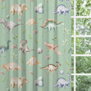 Blackout lined children's bedroom and nursery curtains featuring watercolour dinosaurs on a green background.  Made to measure curtains, custom made to your exact requirements by our professionally trained curtain maker.