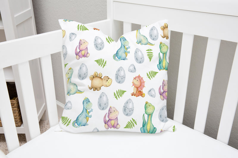 Gender neutral colourful baby dinosaur cushion for children's bedroom or nursery. 