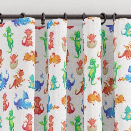 Pencil pleat children's bedroom and nursery curtains in colourful dragon babies print. Big Little Bedrooms. Free Shipping.