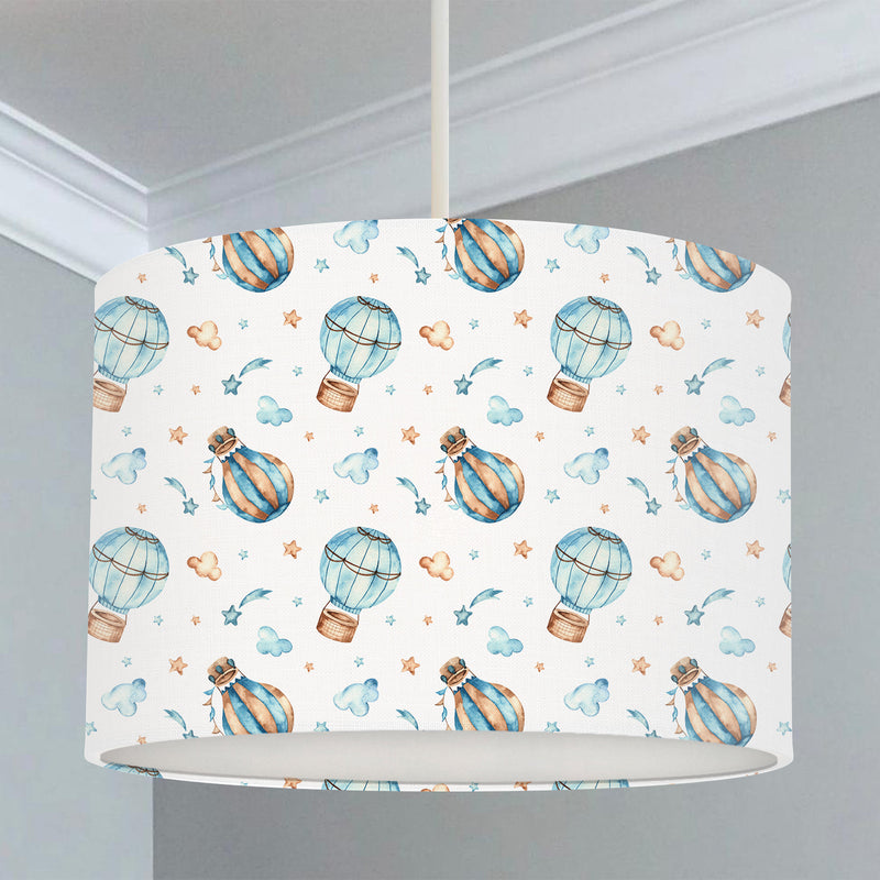 Children's bedroom and nursery lampshade, blue and brown mini hot air balloon, stars, and clouds.