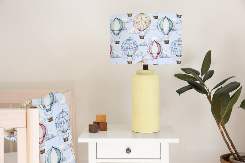 Children's bedroom and nursery ceiling and lampshade, blue and brown hot air balloons and clouds.