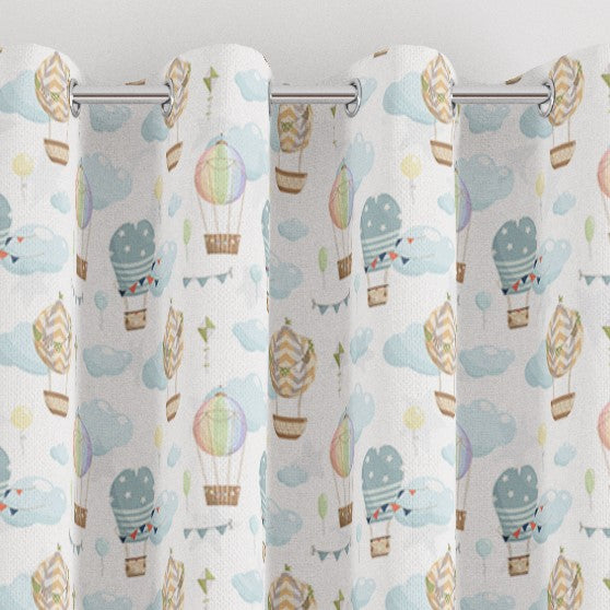 eyelet hot air balloons print children's bedroom and nursery curtains, sky, clouds. Grey, yellow, white and brown.