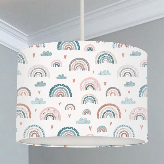 Children's bedroom and nursery ceiling lampshade featuring rainbows, clouds and little hearts in soft blues and pinks.