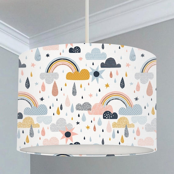 Children's bedroom and nursery ceiling lampshade featuring rainbows, clouds and raindrops in gold, pinks, black and blue.