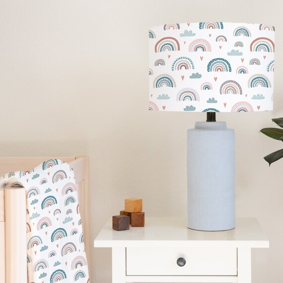 Children's bedroom and nursery lampshade lightshade for ceiling fitting or lamp base featuring rainbows, clouds and little hearts in soft blues and pinks.