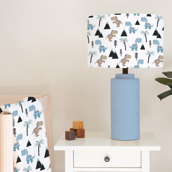 Dinosaurs in blues and browns among mountains on a white background, children's bedroom and nursery lampshade lightshade for ceiling fitting or lamp base. 