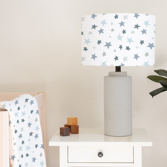 Grey and blue abstract stars on a white background, children's bedroom and nursery lampshade lightshade for ceiling fitting or lamp base. 