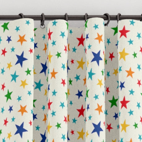 Pencil pleat children's bedroom and nursery curtains in multi coloured stars print. Big Little Bedrooms. Free Shipping. 