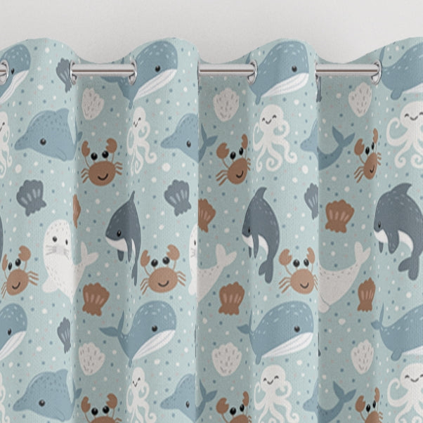 eyelet sea creatures print children's bedroom and nursery curtains, whales, crabs, seals and dolphins. Blue, brown, white.