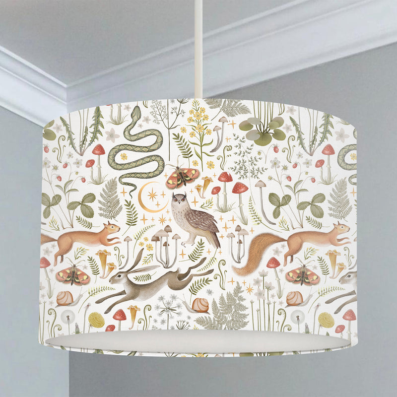 Children's bedroom and nursery lampshade, woodland animals, snakes, rabbits, squirrels, owls, butterflies, and snails, leaves, flowers, and mushrooms. 