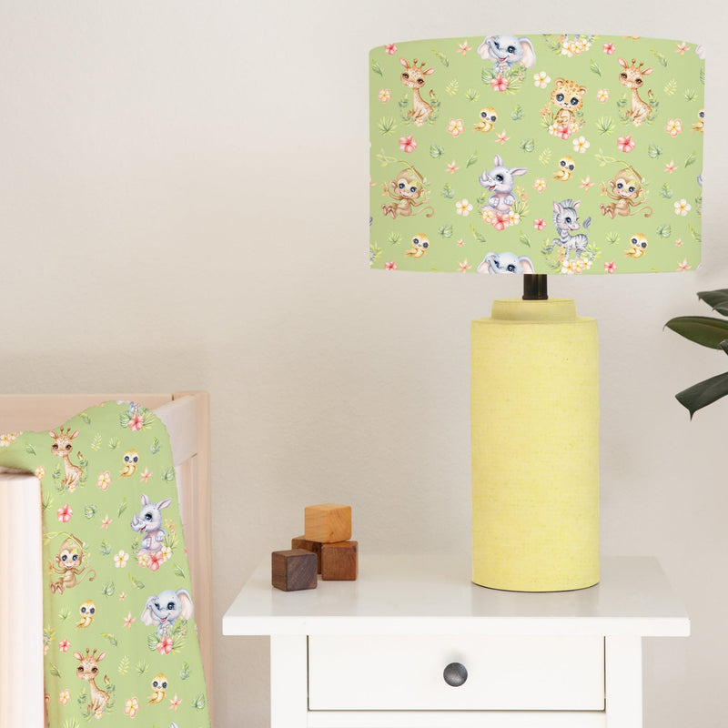 Spring Safari Baby Animals children's bedroom and nursery lampshade, green. This beautiful children's bedroom or nursery lampshade features cute safari baby animals among pretty flowers in bright spring tones of pink, green and yellow.