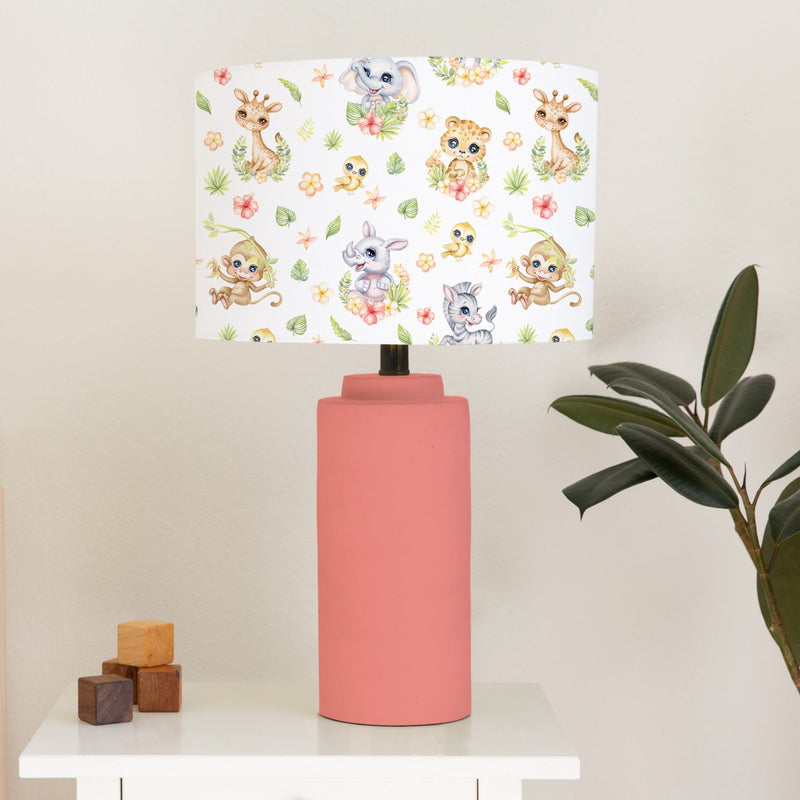 This beautiful children's bedroom or nursery lampshade features cute safari baby animals among pretty flowers in bright spring tones of pink, green and yellow. 