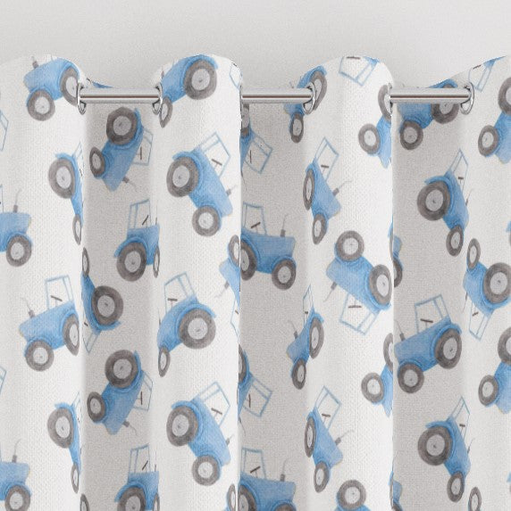 Made to measure blackout lined pencil pleat or eyelet children's bedroom and nursery curtains featuring blue tractors on a white background.