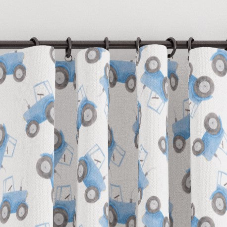 Made to measure blackout lined pencil pleat or eyelet children's bedroom and nursery curtains featuring blue tractors on a white background.